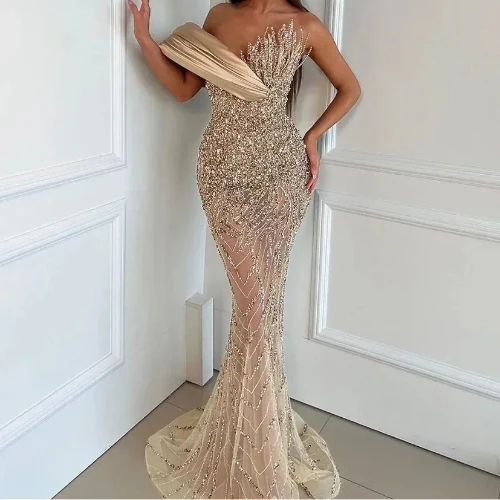 Champagne Radiance Crystal Mermaid Gown With Architectural Satin Drapery And Starburst Bodice